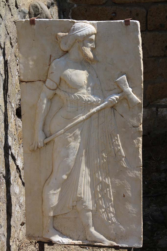 Herculaneum, April 2014.
Sacred Area terrace, the shrine of Four Gods. Reproduction relief of Vulcan.
Photo courtesy of Klaus Heese.